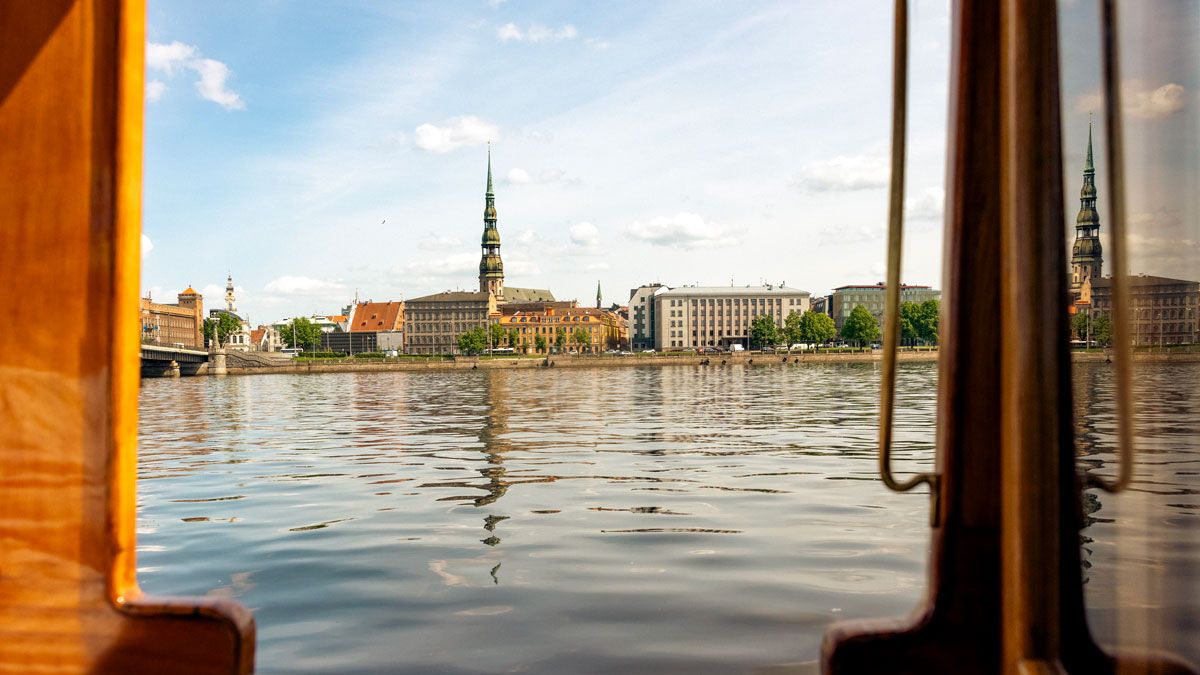 A view of St Peter’s Church, Riga, as seen from a boat, linking to www.bahighlife.com.
