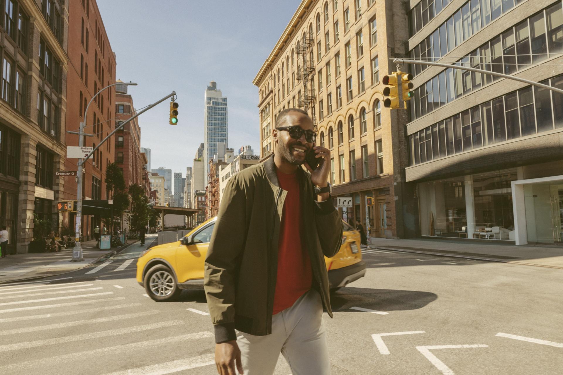 Adult on the phone walking on the streets of Manhattan in New York City.