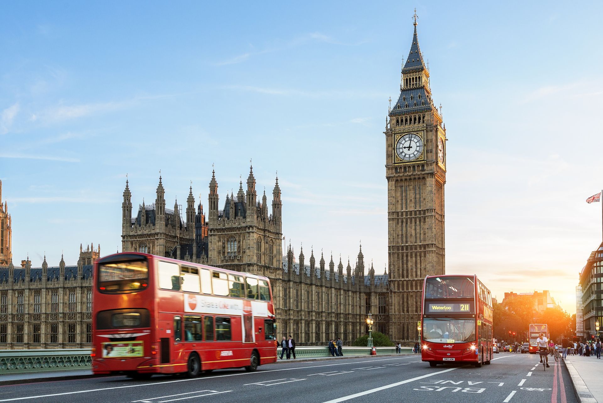 Buses on Westminster Bridge outside Big Ben and the Houses of Parliament in London.