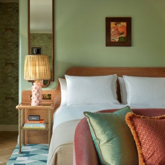 Closeup of a bed at Broadwick Soho hotel in London, linking to BA High Life site.