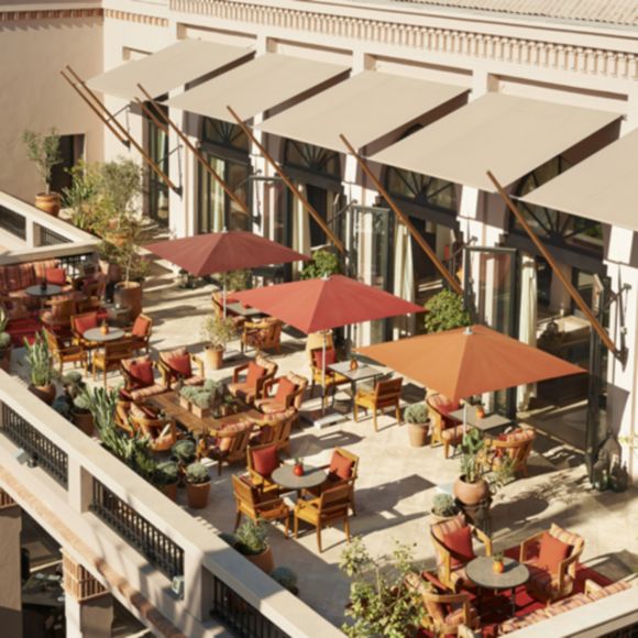 Looking down on a patio at Four Seasons Resort Marrakech, linking to www.bahighlife.com.