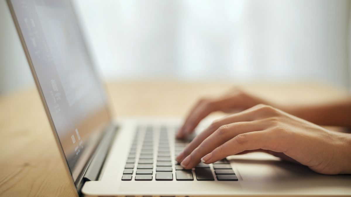 A person typing on a keyboard