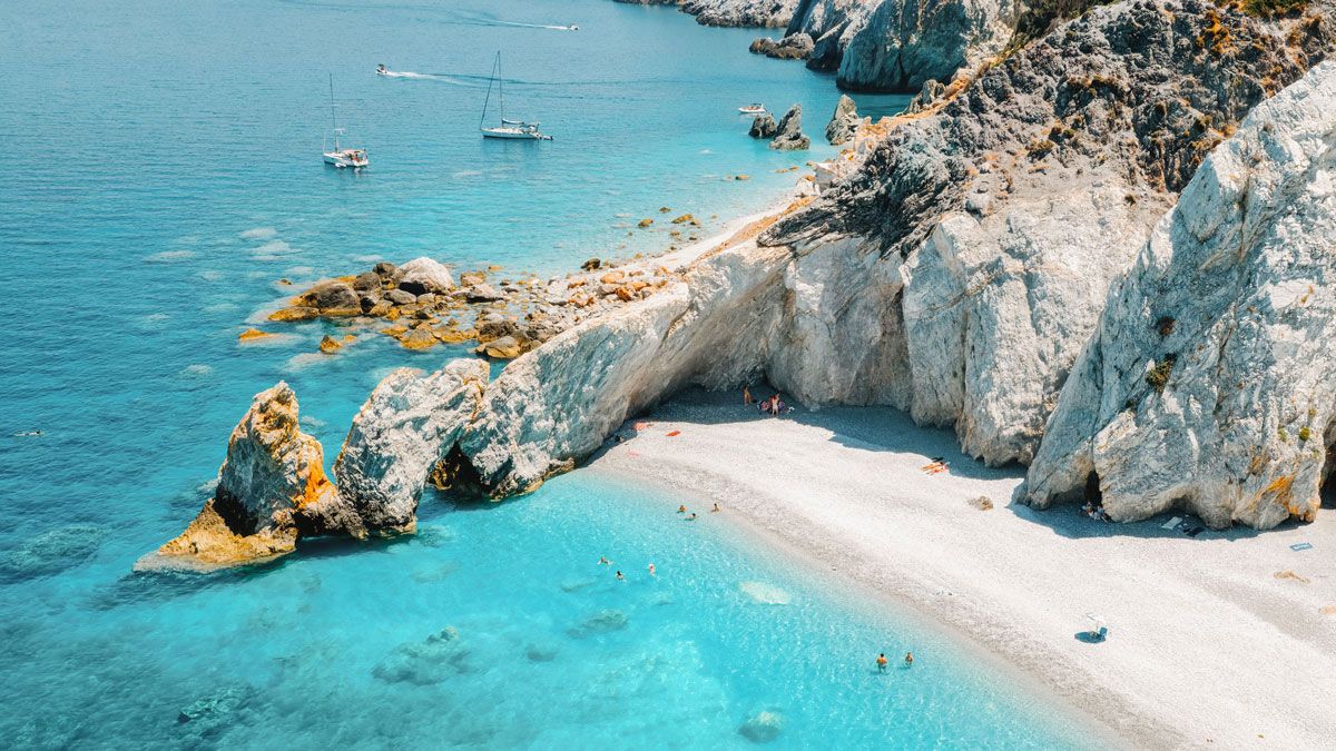 Aerial view of the turquoise sea at Lalaria Beach, Skiathos island, linking to BA High Life site.