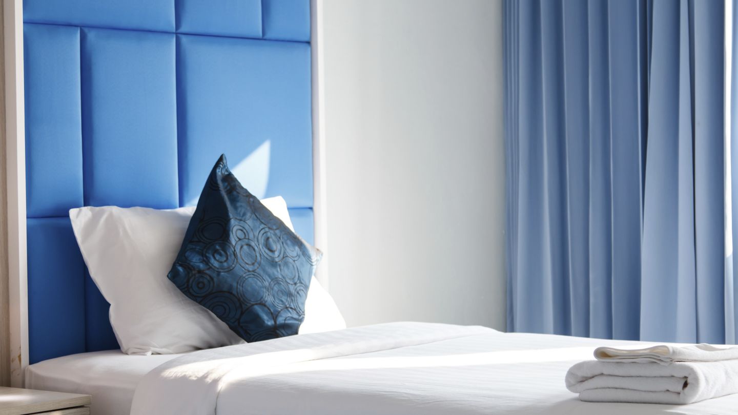 A freshly made hotel bed