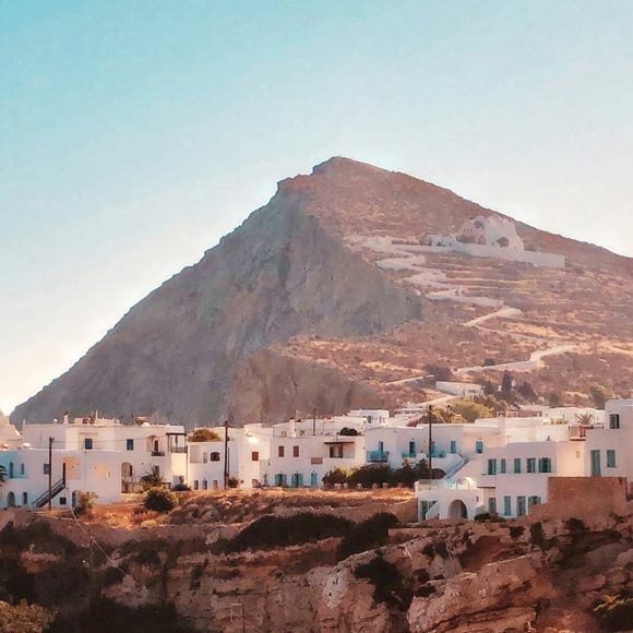 The Church of Panagia on the clifftop looking over the main town of Chora in Folegandros, linking to BA High Life website.
