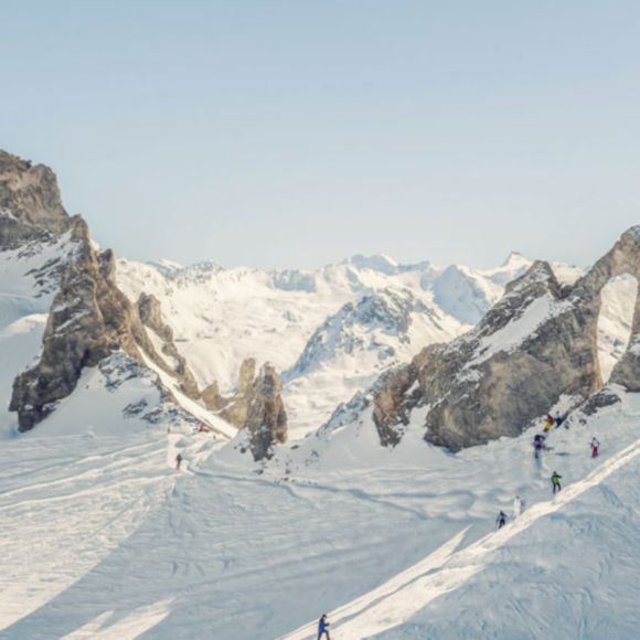 The snowy French Alps mountains with rock formations in the Tignes ski resort, linking to BA High Life site.