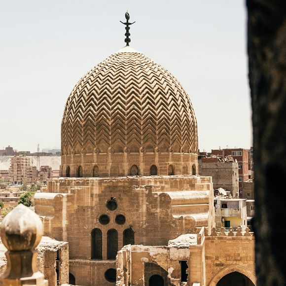 The dome of a mosque and the city beyond spotted in Cairo, linking to BA High Life website.